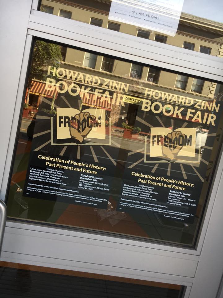 2016 Howard Zinn Book Fair posters in window